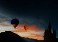 Fairy tale world. Hot air balloons flying near hideaway castle Royalty Free Stock Photo