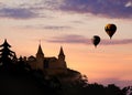 Fairy tale world. Hot air balloons flying near hideaway castle