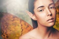 Fairy, woman and wings in nature with makeup, portrait or glow for fantasy, dream or surreal story. Girl, magic and Royalty Free Stock Photo