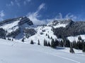 Fairytale alpine winter atmosphere and snow-capped alpine peaks Stockberg 1781 m and Chli Stockberg 1597 m in the Alpstein