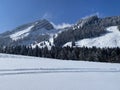 Fairytale alpine winter atmosphere and snow-capped alpine peaks Stockberg 1781 m and Chli Stockberg 1597 m in the Alpstein