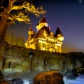 Fairytale castle with fortifications illuminated by yellow light, ai generated art