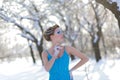 fairytale cosplay of ice queen. Woman in the dress posing in the snowy forest Royalty Free Stock Photo