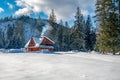 A fairytale cottage, alone stands at the edge of the forest, among old spruces Royalty Free Stock Photo