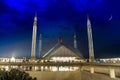 Faisal Mosque in the Darkness of the night with a perfect crescent in the sky