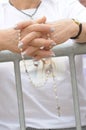 Faith - Older Female Hands in Prayer with Rosary Royalty Free Stock Photo