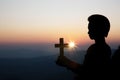 Spiritual prayer hands over sun shine with blurred beautiful sunset background Royalty Free Stock Photo