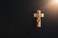 Faith hope love concept: Wooden Christian cross with black background. Royalty Free Stock Photo