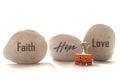 Faith Hope And Love. Religious Single Word On Stones On White Background.