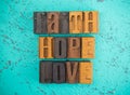 Faith Hope and Love Spelled in Wooden Type Set Block Letters