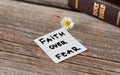 Faith over fear. Inspiring handwritten quote from the Bible Book