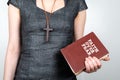 Faith over fear. Woman holding an old book