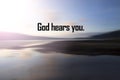 Faith quote - God hears you. Believe in God concept with sunset over the smooth water background on sea. Spirituality.