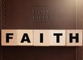 Faith Spelled in Blocks on a Leather Holy Bible