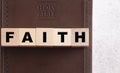 Faith Spelled in Blocks on a Leather Holy Bible