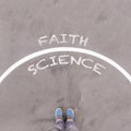 Faith vs science text on asphalt ground, feet and shoes on floor