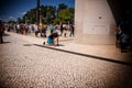 Faithful advancing on their knees in the square of the Sanctuary of Fatima, Portugal