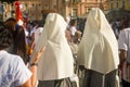 Faithful Catholics are standing waiting for the Mass to celebrate the day of Corpus Christ