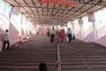 Faithful Devotees climb steep steps to temple on pilgrimage in India