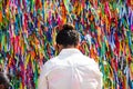 Faithful pray in front of the grid of the church of Senhor do Bonfim on the traditional first Friday of 2023