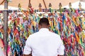 Faithful pray in front of the grid of the church of Senhor do Bonfim on the traditional first Friday of 2023