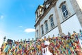 Faithful pray in front of the grid of the church of Senhor do Bonfim on the traditional first Friday of 2023