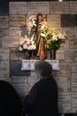 The faithful pray in front of the statue of Saint Anthony of Padua in the chapel of Our Lady of the Kamenita vrata Stone Gate in