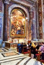 Faithful pray before the tomb of St. John Paul II at the Basilica of St. Peter's in the Vatican, Rome, Italy