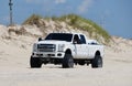 Faithful Steward, Delaware, U.S - July 4, 2023 - A white Ford truck with surf fishing beach permit near Savage Ditch