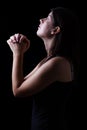 Faithful woman praying in worship to god looking up in hope Royalty Free Stock Photo