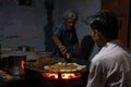 A man cooks up a popular street food called aloo tikki Royalty Free Stock Photo