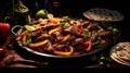 Fajita with beef and colorful bell peppers, served in skillet with tortillas. On dark background. Traditional Mexican Royalty Free Stock Photo