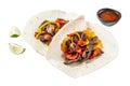 Fajitas with beef meat stripes, colored bell pepper and onions, served with tortillas and salsa. Isolated on white