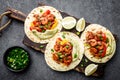 Fajitas in tortillas with fried shrimps, bell peppers and onion