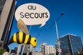 Fake Bee with Au Secours Sign