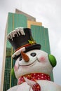 Fake Christmas snowman with city view