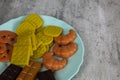 Fake food in a blue plate on a white background Royalty Free Stock Photo