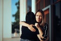 Envious Woman Hugging Her Friend Feeling Skeptical