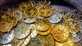 Fake gold and silver coins closeup