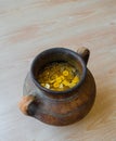 Fake gold and silver coins in earthenware jar