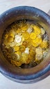 Fake gold and silver coins in earthenware jar