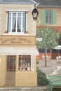 Fake grocery and cafe as fresco on a house facade in France