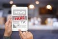 Fake news concept man reading news media technology on smartphone just Fake Royalty Free Stock Photo