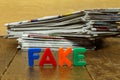 Fake news concept with newspapers and letters Royalty Free Stock Photo