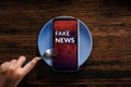 Fake News Concept. Reading Daily Fake News from Mobile Phone or Social Media Like Eating Breakfast in every morning