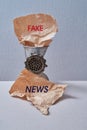 Fake news, disinformation or false information and propaganda concept. Meat grinder and crumpled paper