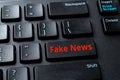 Fake News enter key on the black pc keyboard. Spread false information in the media concept. Propaganda, manipulation and hoax on Royalty Free Stock Photo