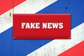 Fake news. The inscription on a red plate on the background of the flag of Thailand. Information