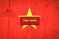 Fake news. The inscription on a red plate on the background of the flag Of Vietnam. Information