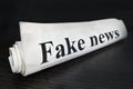 Daily news newspaper headline reading fake news concept for false event news headline. Fake News Newspaper on desk in the office. Royalty Free Stock Photo